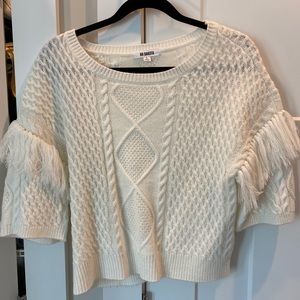 White fringed sweater